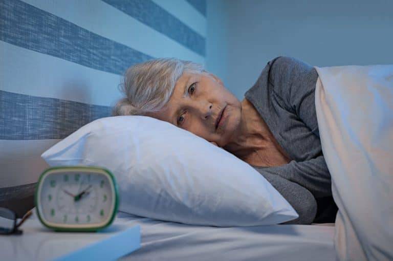 older woman with disrupted sleep