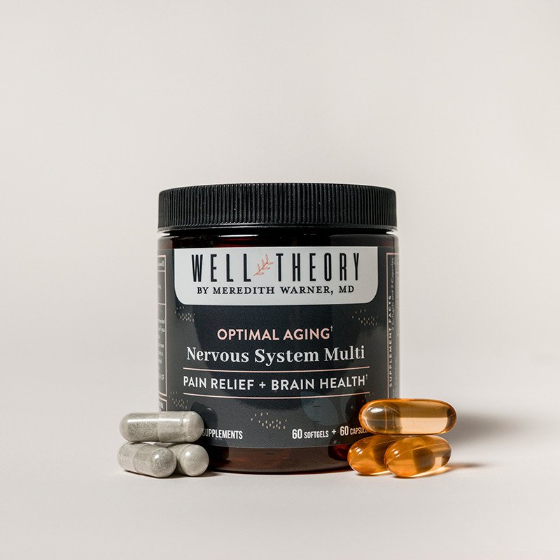 A jar labeled "Well Theory Nervous System Multi" with gray capsules and orange softgels on a plain background.